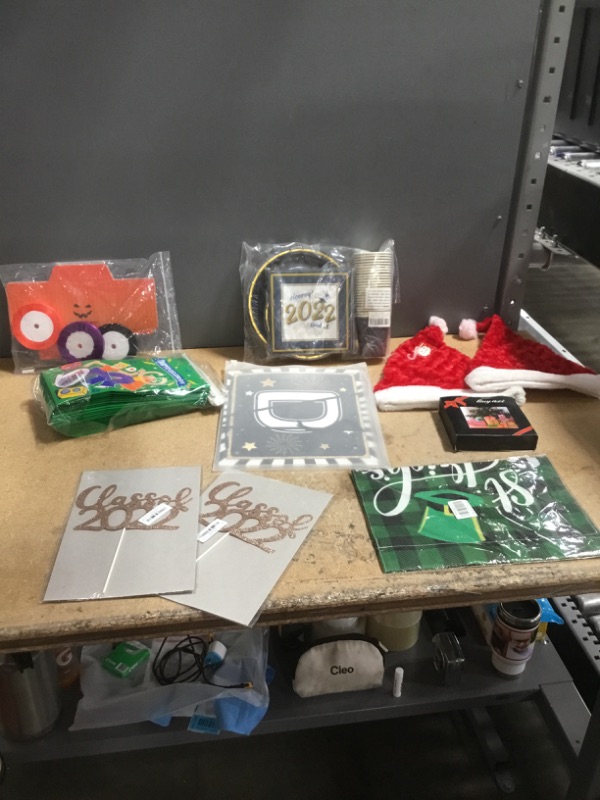 Photo 2 of **NON-REFUNDABLE***
ASSORTED DECORATION
HALLOWEEN DECORATIONS, PARTY GIFT BAGS,  2 2022 PARTY DECORATION AND PARTY SUPPLIES, 2 SANTNA HATS,  X-MAS CARDS,  ST PATRICK TAPISTY, 2 CLASS OF 2022 DECALS