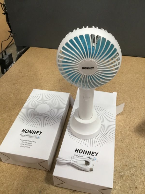 Photo 2 of 2 
HonHey Handheld Fan Portable, Mini Hand Held Fan with USB Rechargeable Battery, 4 Speed Personal Desk Table Fan with Base, 3 Speed