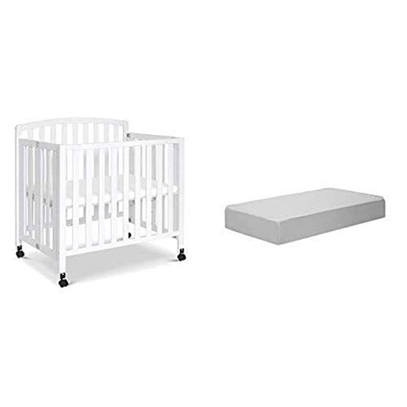 Photo 1 of **MATTRESS ONLY-** -DaVinci Dylan Folding Portable Three-in-one Mini Crib and Twin Bed in White with Complete Slumber Mini Crib Mattress
