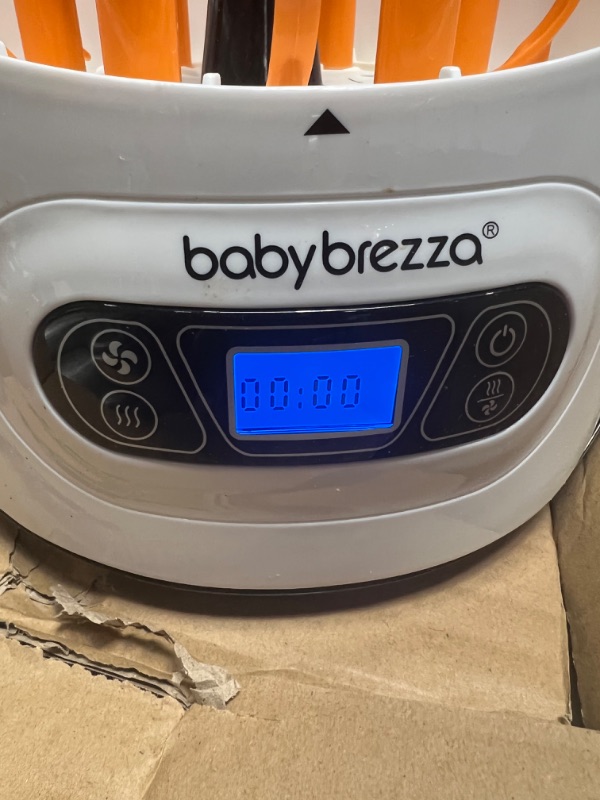 Photo 3 of Baby Brezza Electric Baby Bottle Sterilizer and Dryer Machine â?? Steam Sterilizer - Universal Fit Steamer - Sterilizes Pacifiers, Glass, Plastic, and Newborn Feeding Bottles
