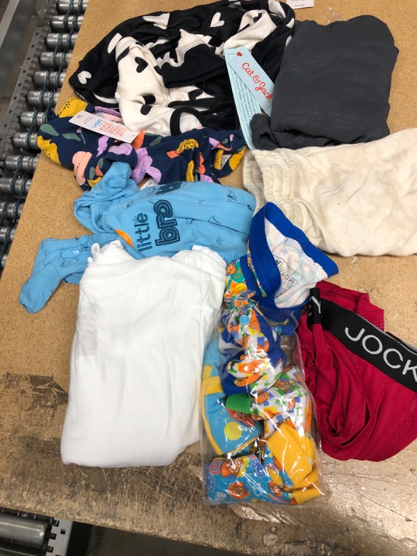 Photo 1 of **ASSORTED ADULT AND KIDS CLOTHES**
1) Hanes Boys' EcoSmart Crewneck Undershirt 5-Pack White XS
2) 5 PAIR BOYS 4T UNDERWEAR
3) GIRLS PJ'S SIZE7/8
4) WOMEN'S L TANKTOP
5)KID XSMALL SHORTS
6) MEN'S SIZE S UNDERWEAR
