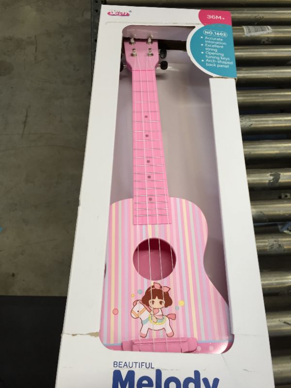 Photo 2 of BAOLI light pink color plastic beautiful melody Ukulele toy with accurate intonation excellent string opening tuning keys arch-shaped back panel
