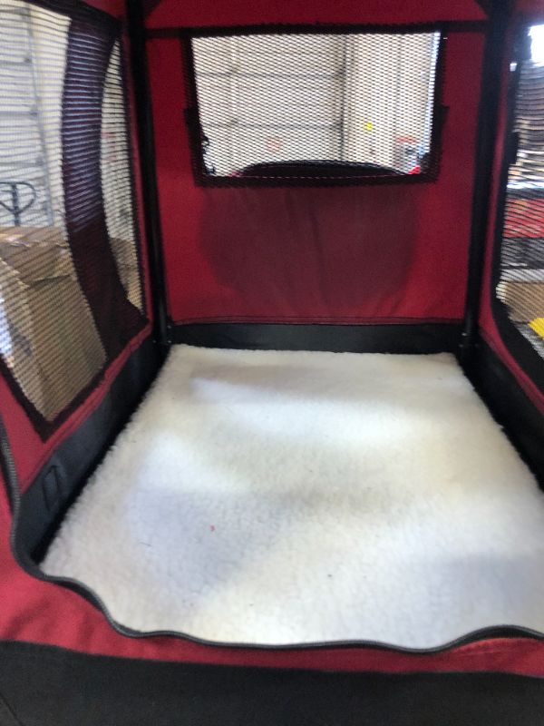 Photo 6 of EliteField 3-Door Folding Soft Dog Crate --- hole in entrance as shown.