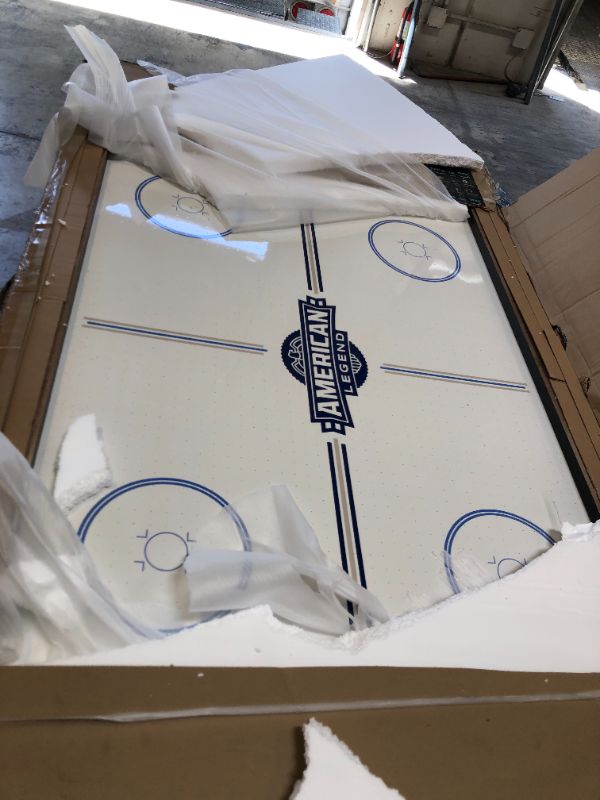 Photo 2 of American Legend Kirkwood 84” Air Powered Hockey Table with Rustic Wood Finish, K-Shaped Legs and Modern Design. Damage Wood Playing Surface as shown in pictures. Box packaging Damaged. 
