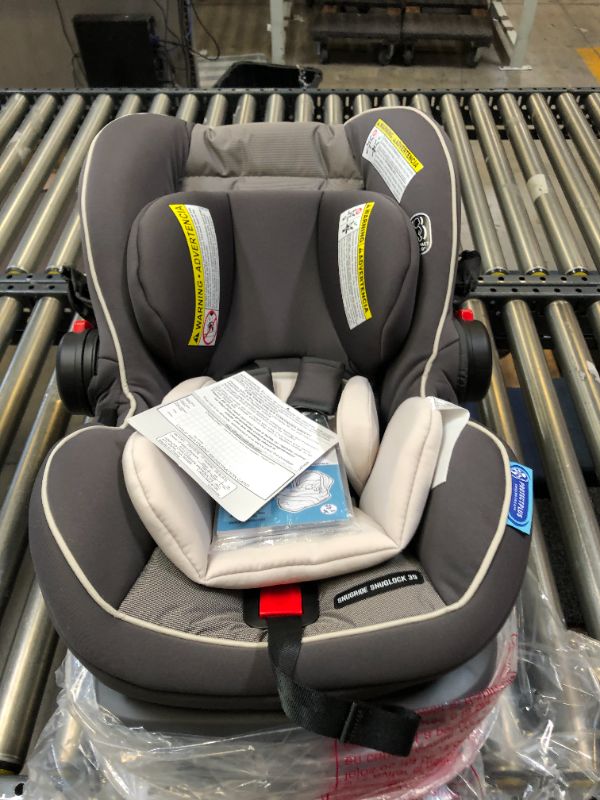 Photo 2 of Graco SnugRide SnugLock 35 Elite Infant Car Seat, Baby Car Seat, Oakley. Box Packaging Damaged, Item is New
