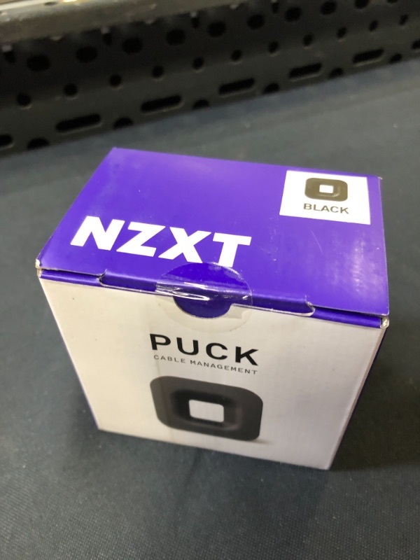 Photo 2 of NZXT Puck - BA-PUCKR-B1 - Cable Management and Headset Mount - Compact Size - Silicone Construction - Powerful Magnet for Computer Case Mounting - Black - SEALED
