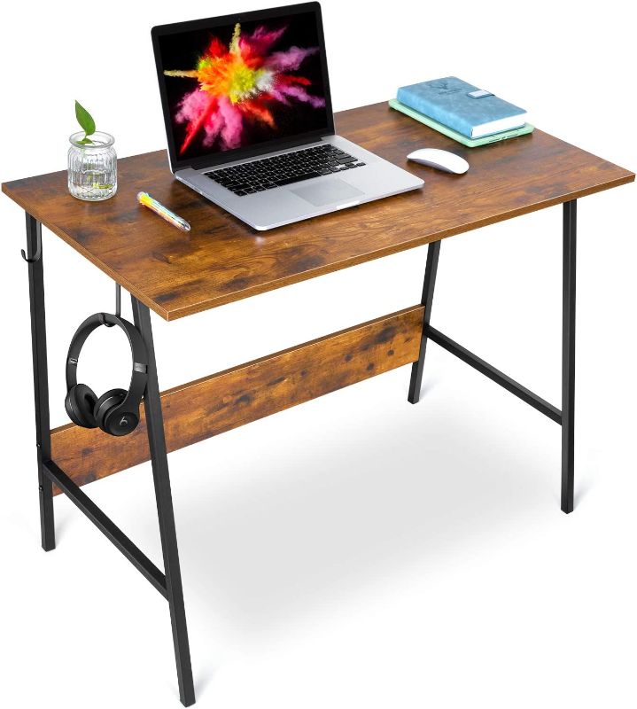 Photo 1 of WEWILL Computer Desk Writing Study Table for Home Office,PC Notebook Writing Table with Stable Trapezoidal Metal Structure Modern Student Desk with Two Hooks,Easy to Install,Rustic Brown
