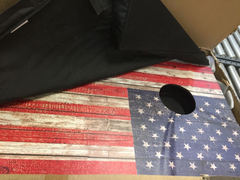 Photo 3 of GoSports American Flag Regulation Size Cornhole Set Includes 8 Bags, Carry Case & Rules, WARPED FROM HEAT, MINOR SCRAPES AND CUT IN CARRYING CASE 