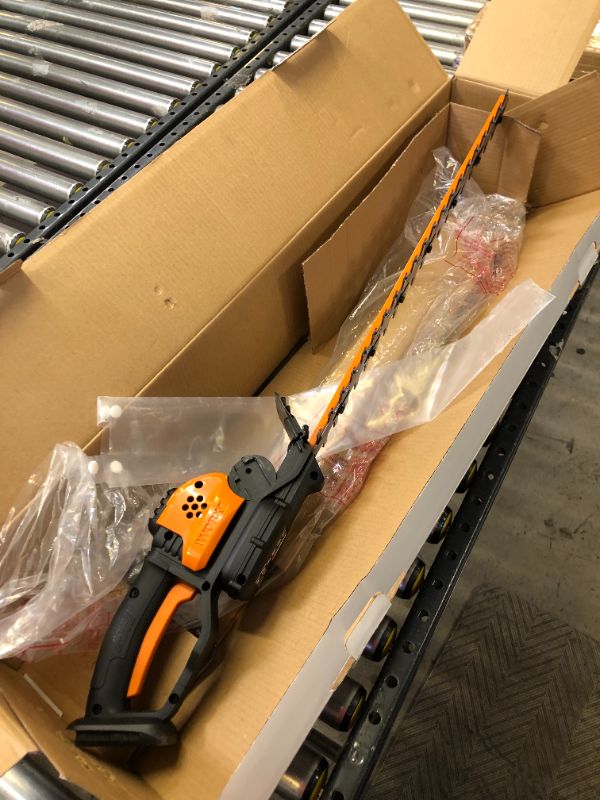 Photo 2 of WORX WG261 20V Power Share 22-inch Cordless Hedge Trimmer, Battery and Charger Included with Power Share 4.0 AH Battery, Orange and Black
