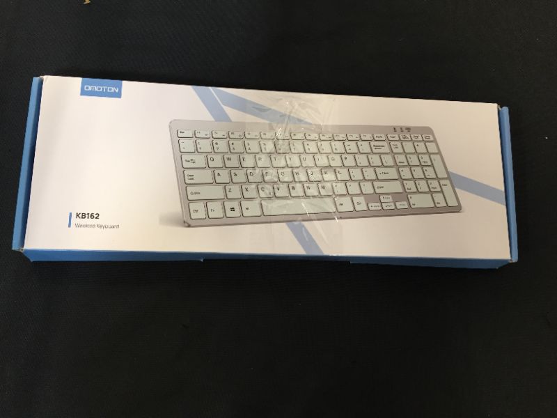 Photo 1 of OMOTON 2.4G Wireless Keyboard Ultra Slim Keyboard with USB Receiver for Computer/Desktop/PC/Laptop/Surface/Smart TV and Windows 10/8/7, Silver-Unable to test in facility 
