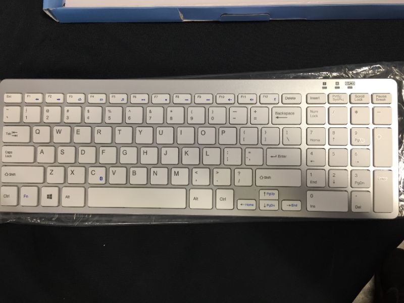 Photo 1 of OMOTON 2.4G Wireless Keyboard Ultra Slim Keyboard with USB Receiver for Computer/Desktop/PC/Laptop/Surface/Smart TV and Windows 10/8/7, Silver-Unable to test in facility 
