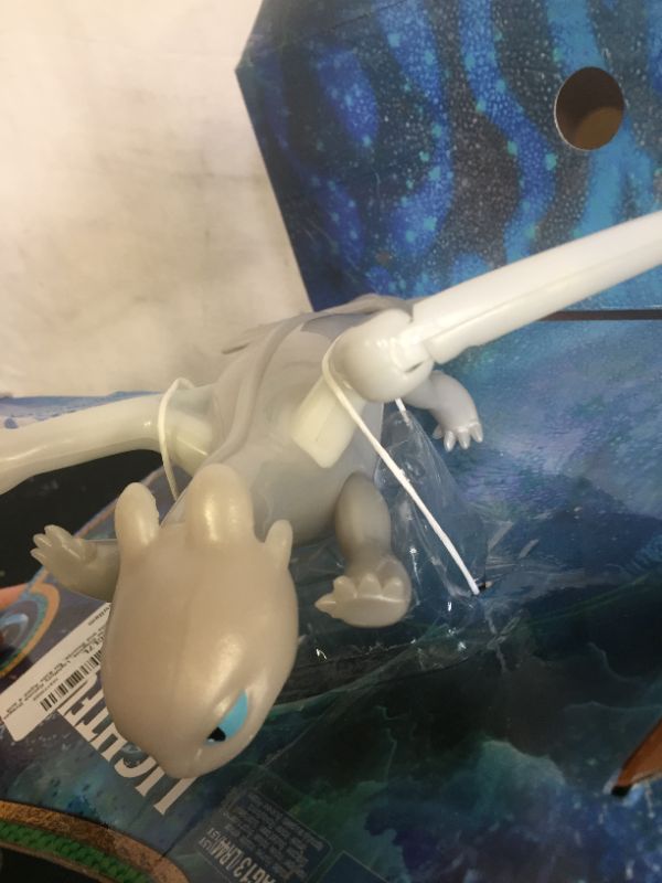 Photo 4 of Dreamworks Dragons, Lightfury Deluxe Dragon with Lights and Sounds, for Kids Aged 4 and Up
(box is damaged but item is sealed)