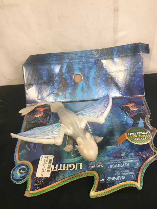 Photo 2 of Dreamworks Dragons, Lightfury Deluxe Dragon with Lights and Sounds, for Kids Aged 4 and Up
(box is damaged but item is sealed)