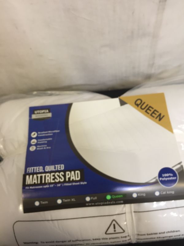 Photo 1 of  fitted mattress pad 
size queen (factory sealed)