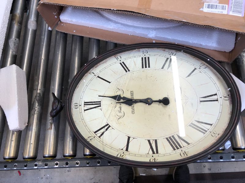 Photo 1 of Creative Co-Op Oval Metal Wall Clock with Bird
