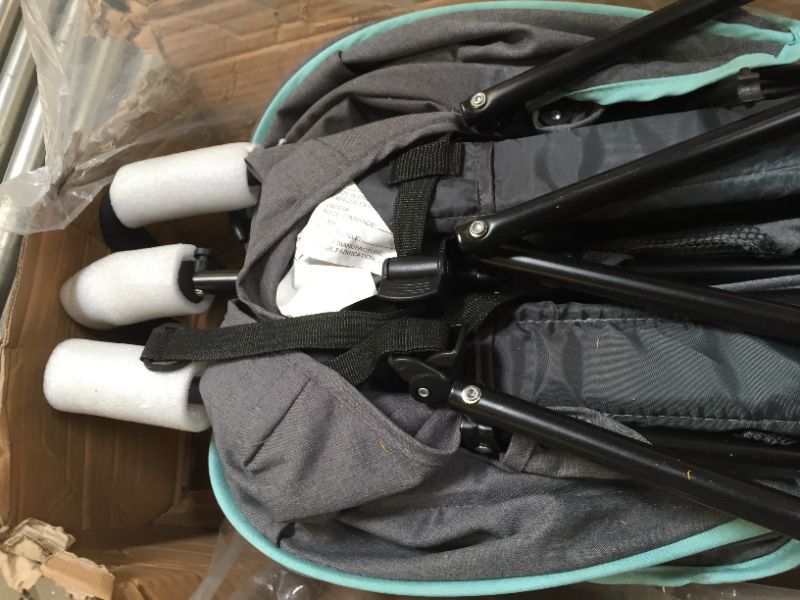 Photo 5 of Dream On Me Volgo Twin Umbrella Stroller in Mint and Dark Grey - Style: 26.5. Heavy Use, box Packaging Damaged, Signs of Use on Wheels. Broken Piece of Plastic Found As Shown in Picture



