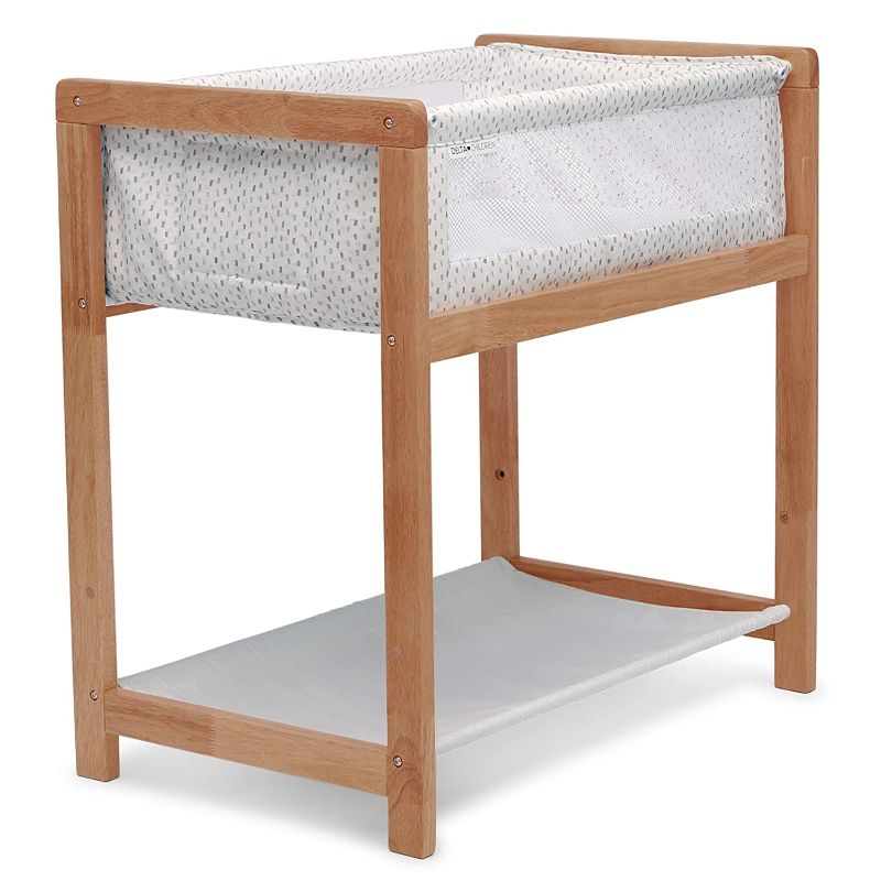 Photo 1 of Delta Children Classic Wood Bedside Bassinet Sleeper Portable Crib with HighEnd Wood Frame, Paint Dabs
