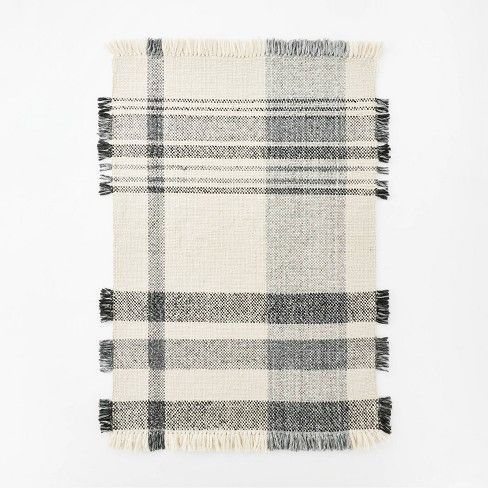 Photo 1 of 5'x7' Laurelhurst Indoor/Outdoor Plaid Rug Black/White. , Minor Dirt Stains on Item, Dirty from Shipping and Handling,
Moderate Use, Hair Found on Item. 