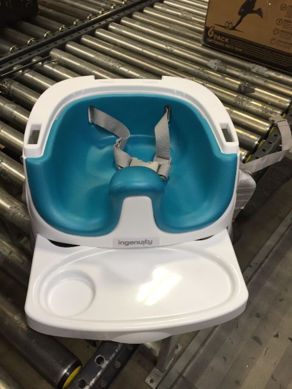 Photo 3 of Ingenuity Baby Base 2-in-1 Booster Feeding and Floor Seat with Self-Storing Tray - Peacock Blue. Moderate Use, scratches and Scuffs onWhite Plastic. Not in Original  Box Packaging, Box Packaging Damaged.
