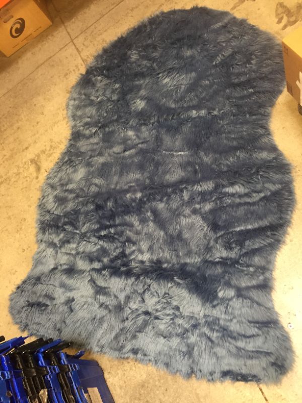 Photo 1 of BLUE RUG (FURRY) 4.5 X 6.5 FT
USED/DUSTY