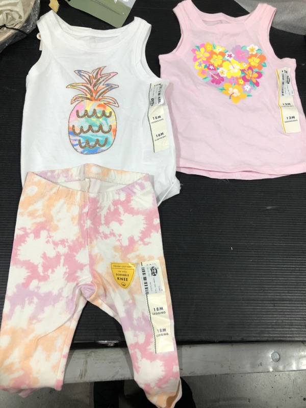 Photo 1 of 2 shirts and 1 pants size 18 months and 12 months