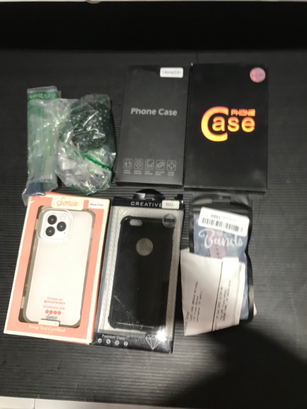 Photo 1 of box lot various items - phone case / airpod case / apple watch band 
