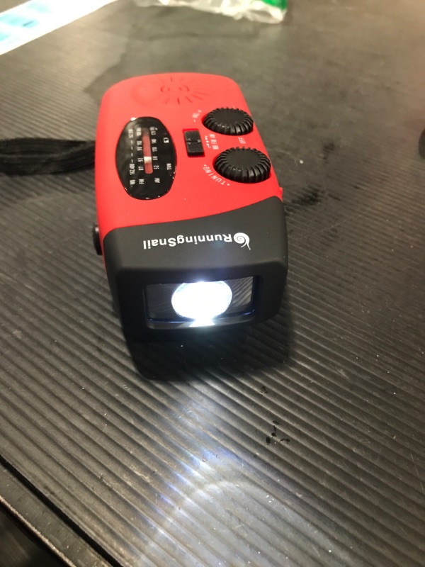 Photo 2 of [Upgraded Version] RunningSnail Emergency Hand Crank Self Powered Am/fm NOAA Solar Weather Radio with LED Flashlight, 1000mAh Power Bank
