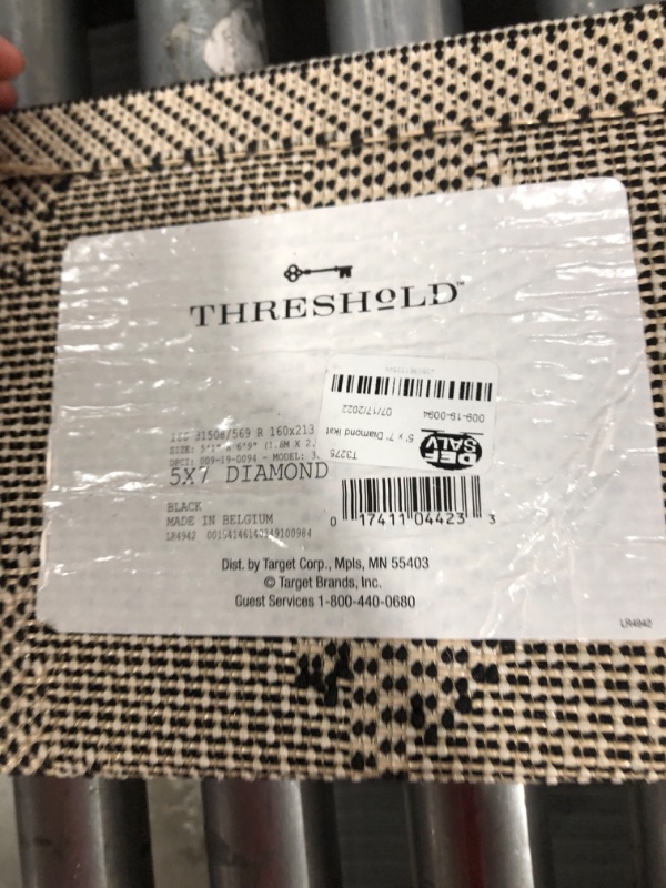 Photo 1 of 5' X 7' Diamond Ikat Outdoor Rug Black - Threshold
