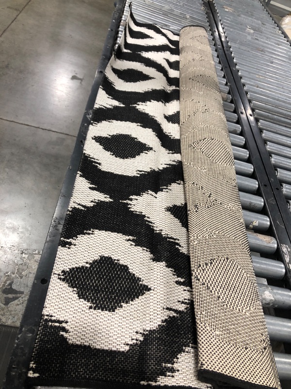 Photo 1 of 5' X 7' Diamond Ikat Outdoor Rug Black - Threshold
