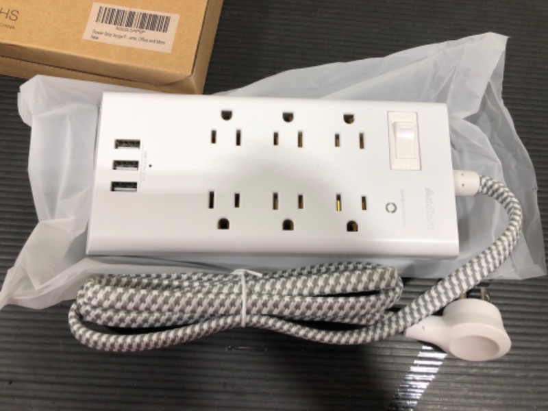 Photo 2 of Addtam Power Strip Surge Protector 6 Outlets and 3 USB Ports 5Ft Long Extension Cord, Flat Plug Overload Surge Protection Outlet Strip, Wall Mount for Home, Office and Dorm
