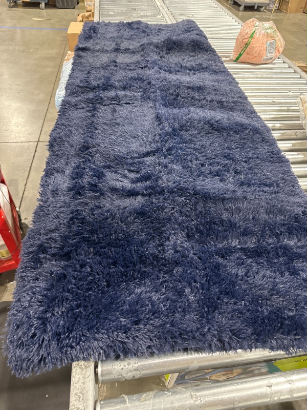 Photo 1 of 90X64 " BLUE RUG 
