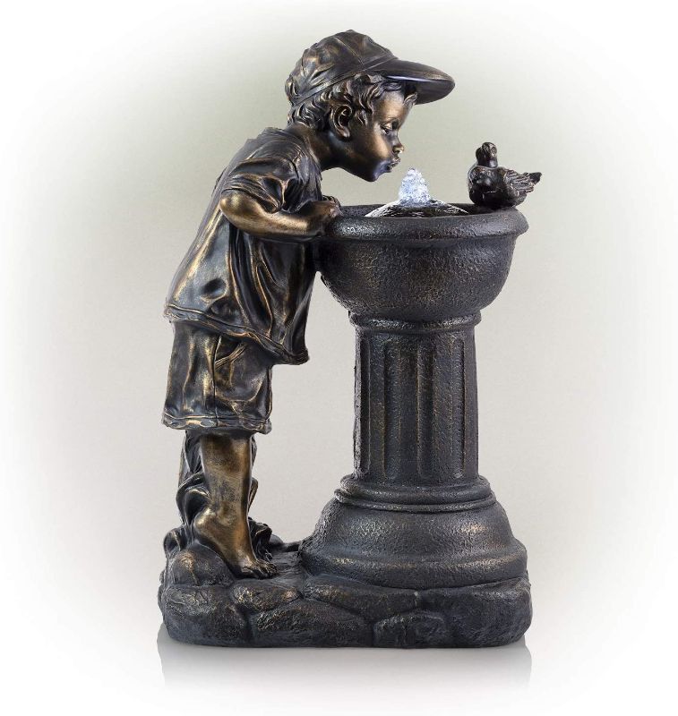 Photo 1 of Alpine Golden Boy Drinking Water Out of Fountain with LED Light