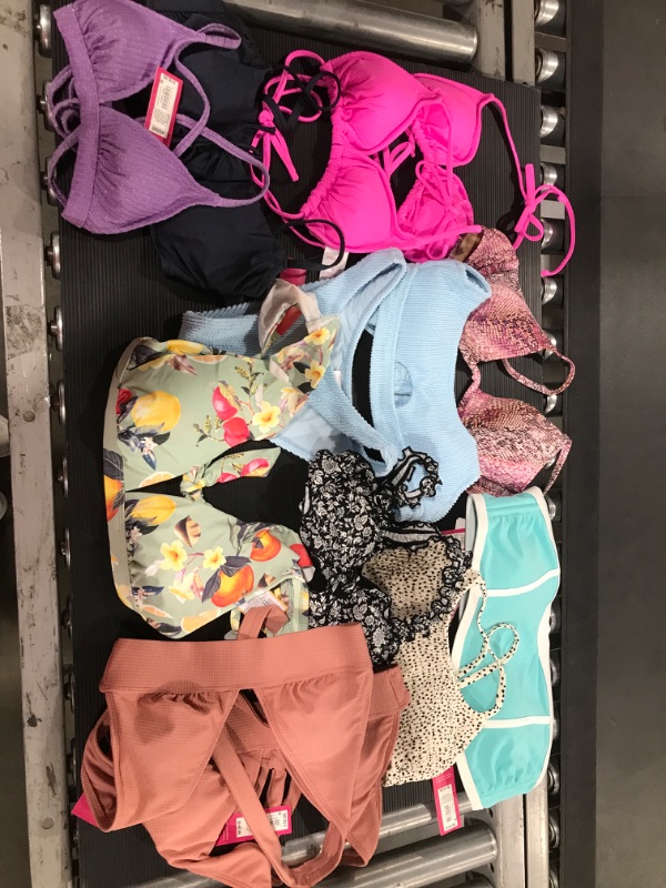 Photo 1 of  Box lot of 2 piece swimsuits. sizes vary throughout items. 