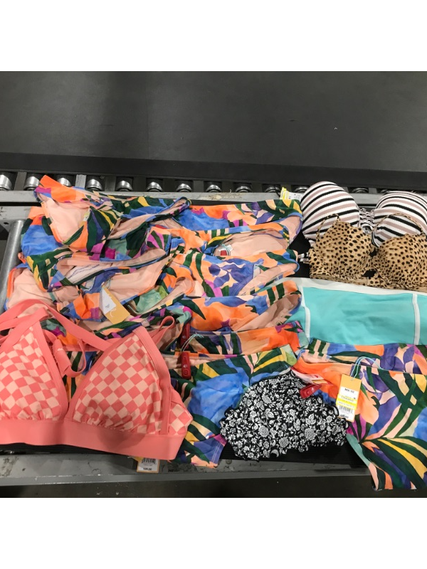 Photo 1 of A miscellaneous bag of women's swim suits. Containing 2 pieces (MAINLY BOTTOMS) . SIZES VARY. Some items still have red sensor tag. 