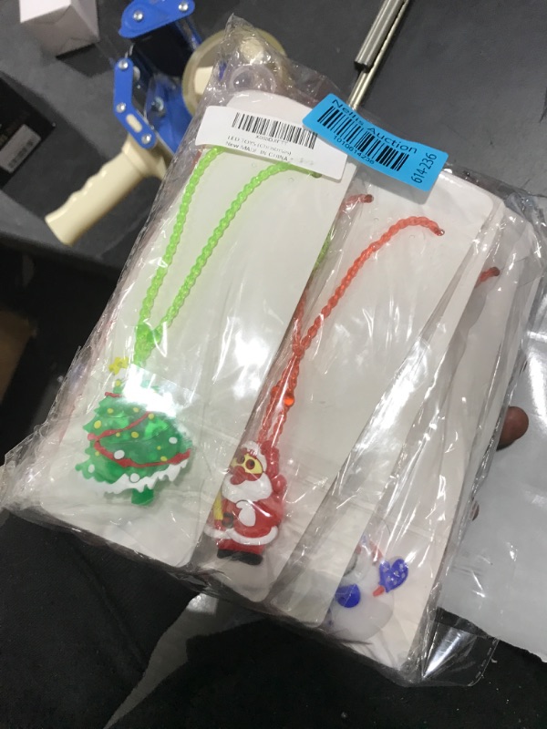 Photo 1 of Christmas Gifts for Kids Toys Party Favors - 72 PCS Christmas Toys Stocking Stuffers Glow In The Dark Party Supplies, 30 Rings + 30 Brooches + 6 LED Necklaces + 6 LED Bracelets, Christmas Party Favors