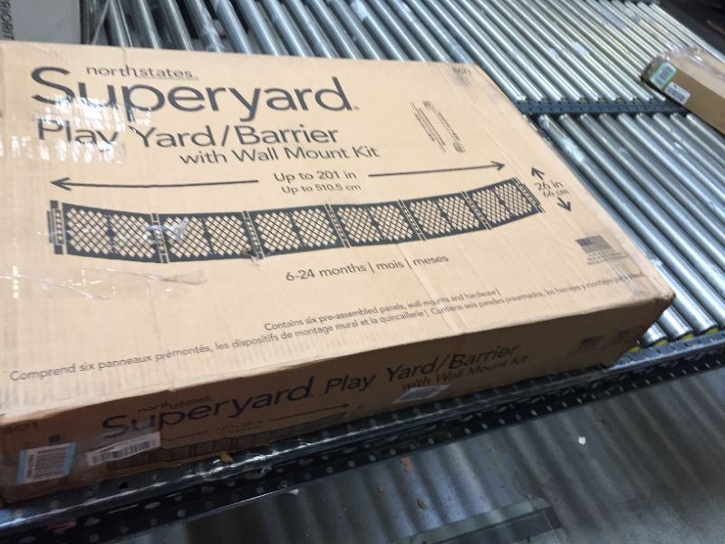 Photo 1 of Toddleroo by North States Superyard 6 Panel Baby Play Yard/Barrier with Wall Mount Kit, Made in USA: Extra wide barrier or safe play area. 38.5" - 201" wide, 18.5 ft. enclosure (26" tall, Gray)
