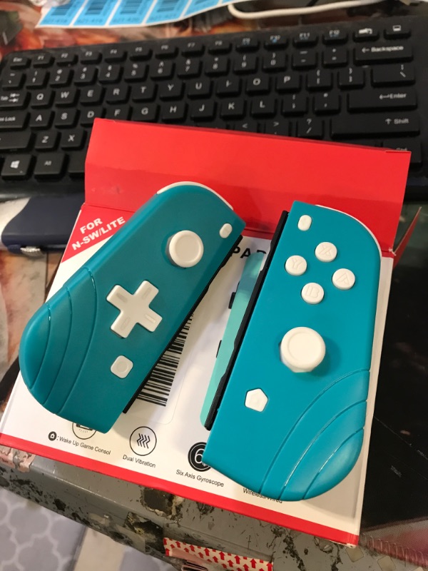 Photo 1 of Joy Pad Teal Wireless Controllers