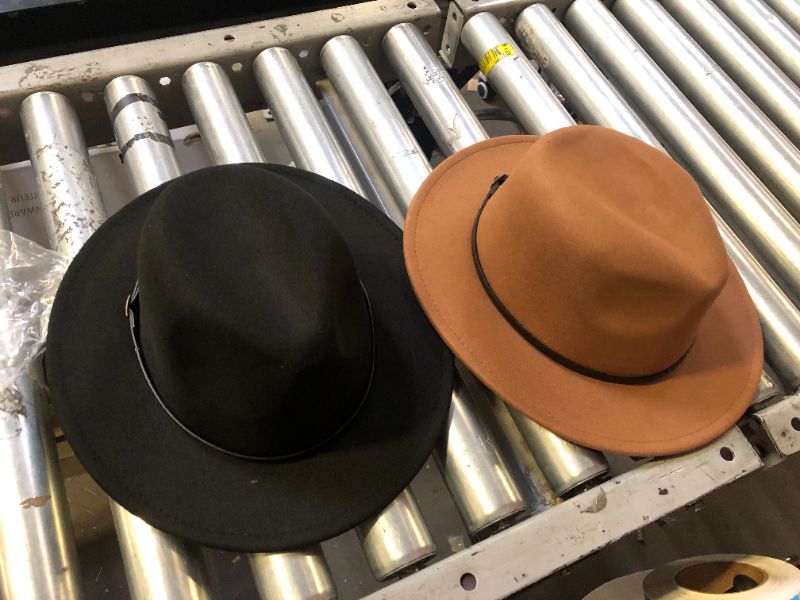 Photo 1 of brown hat and black hat 