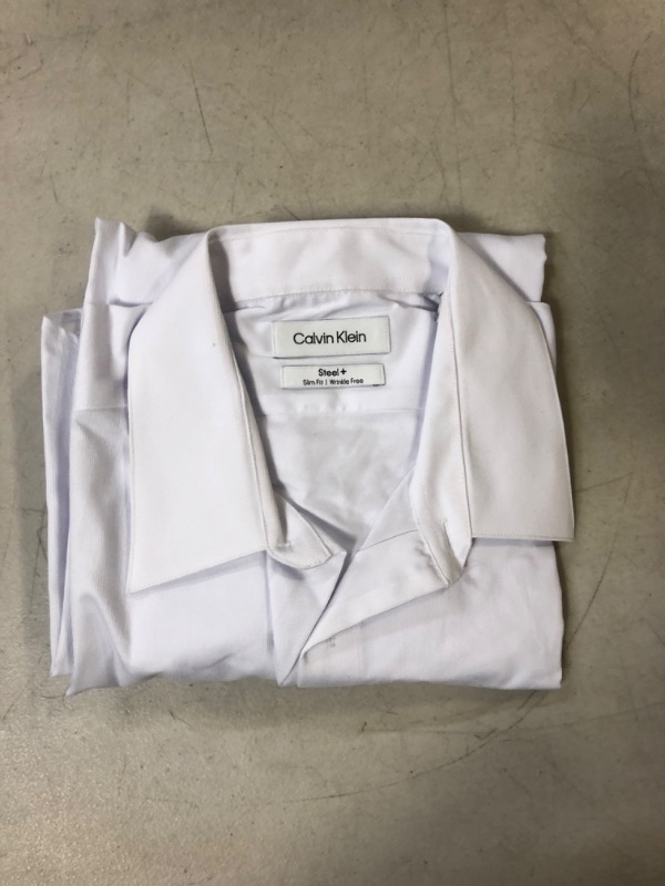 Photo 2 of Calvin Klein Men's Non Iron Slim Fit Solid Point Collar Dress Shirt, White, 15.5" Neck 36"-37" Sleeve. Size Medium