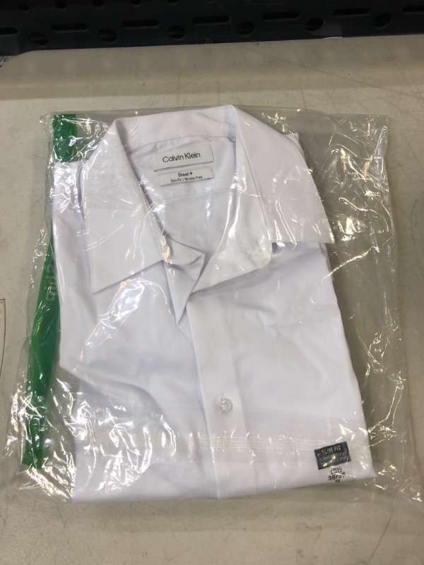 Photo 5 of Calvin Klein Men's Non Iron Slim Fit Solid Point Collar Dress Shirt, White, 15.5" Neck 36"-37" Sleeve. Size Medium