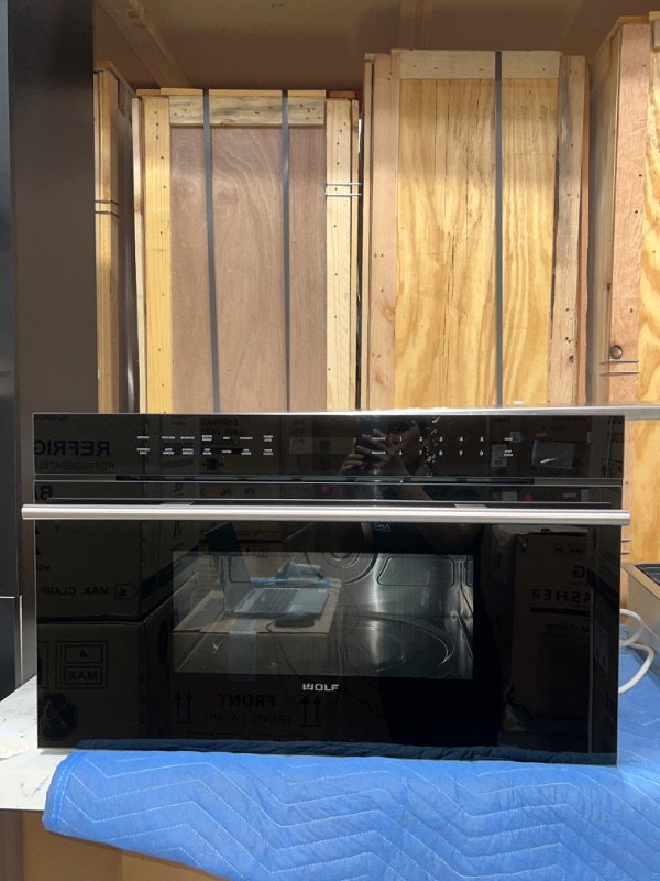 Photo 2 of WOLF BRAND 30" M Series Contemporary Drop-down Door Microwave Oven, Model # MDD30CM/B/TH *** ITEM HAS SMALL AMOUNT OF REMOVABLE ADHEDSIVE ON THE FRONT TOP SURFACE*** (OUT OF BOX)