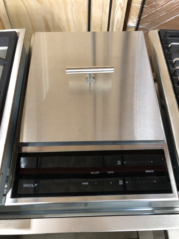 Photo 2 of 15 Inch Built-In Teppanyaki Module with (2) 1400-Watt Induction Zones, Easy to Clean Stainless Steel Surface, Fast Preheat, Illuminated White LED Sliding Touch Controls and Control Lock Feature
