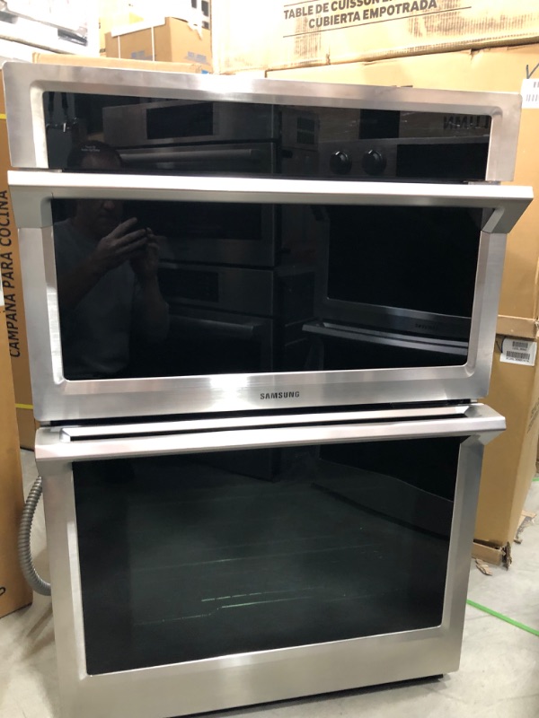 Photo 2 of SAMSUNG MODEL #NQ70M6650DS
30" Microwave Combination Wall Oven with Steam Cook and WiFi - Stainless steel
+++ ITEM HAS SOME GREASE ON THE INSIDE BOTTOM OF OVEN +++
