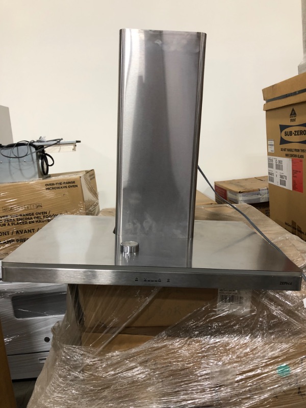 Photo 2 of Zephyr Europa Luce Series ZLUE30AS
30 Inch Wall Mount Chimney Hood with 600 CFM Internal Blower, 5 Speeds, Dishwasher Safe Aluminum Mesh Filters, ACT Technology, ICON Touch Controls, Dual Level Bloom LED Lighting, 3 Color Trim Lighting and Recirculating O