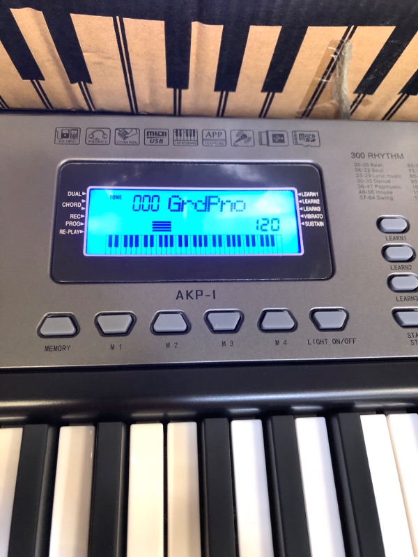 Photo 3 of  61 Portable Electronic Keyboard with Key Note Stickers, Power Supply and Simply Piano App Content, Compact 