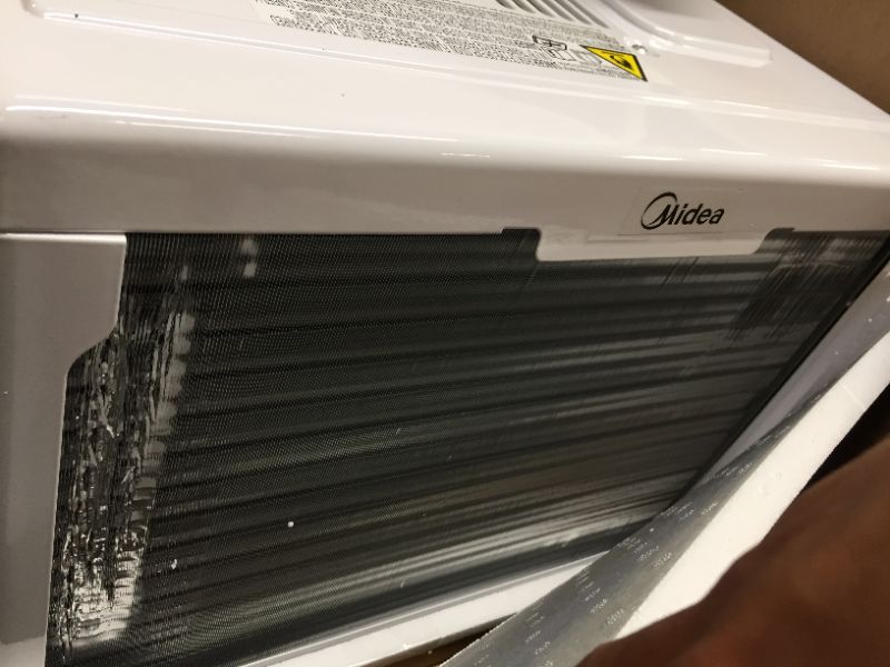 Photo 1 of Midea 8,000 BTU U-Shaped Smart Inverter Window Air Conditioner–Cools up to 350 Sq. Ft., Ultra Quiet with Open Window Flexibility, Works with Alexa/Google Assistant, 35% Energy Savings, Remote Control 8000 BTU AC - HEAVY DAMAGE AROUND THE GILLS OF BACK