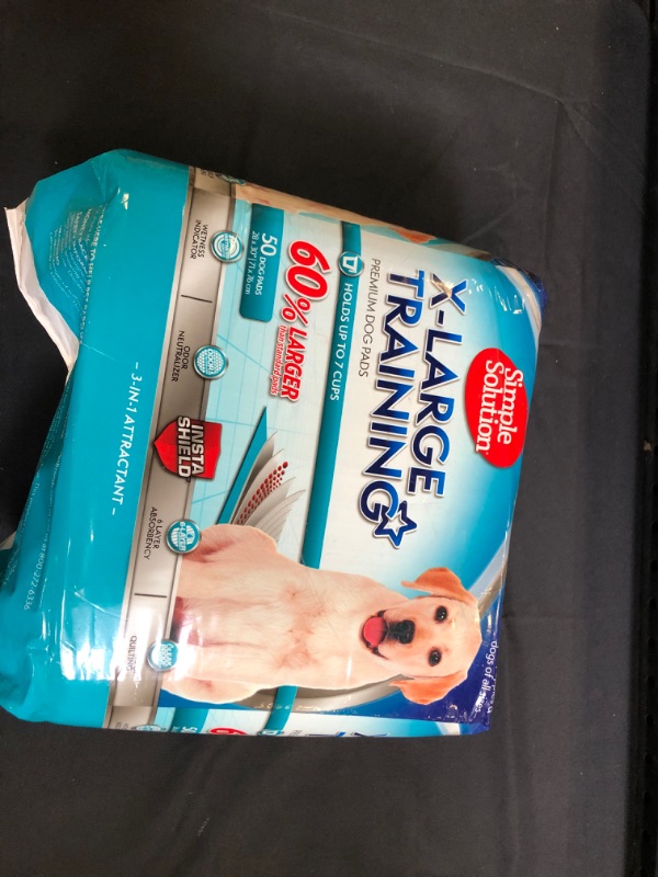 Photo 1 of Simple Solution Training Puppy Pads | Extra Large, 6 Layer Dog Pee Pads, Absorbs Up to 7 Cups of Liquid | 28x30 Inches [ opened / may be missing a few ] 