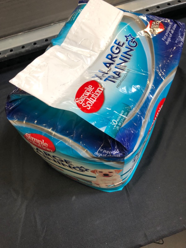 Photo 1 of Simple Solution Training Puppy Pads | Extra Large, 6 Layer Dog Pee Pads, Absorbs Up to 7 Cups of Liquid | 28x30 Inches [ opened / may be missing a few ] 