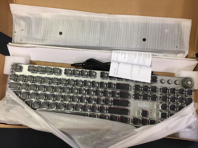 Photo 1 of FIODIO MECHANICAL GAQMING KEYBOARD
BOX IS DAMAGED DUE TO EXPOSURE