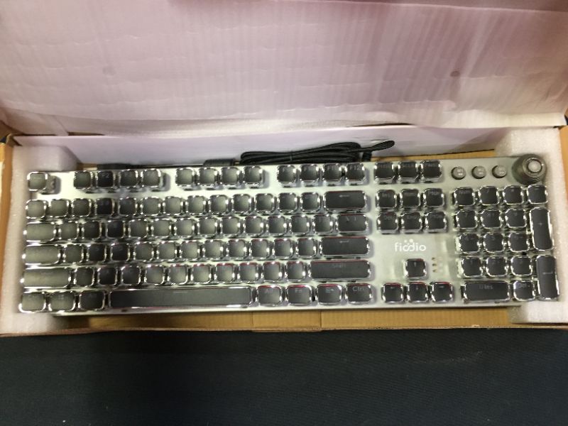 Photo 1 of MECHANICAL GAMING KEYBOARD BOX IS DAMAGED DUE TO EXPOSURE